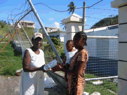 Ms. Ann Hopkin helping the needy after Hurricane Ivan's wrath